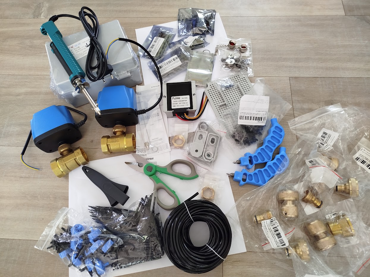 The parts list for an irrigation build: motorised valves, drip fittings, tubing and control electronics