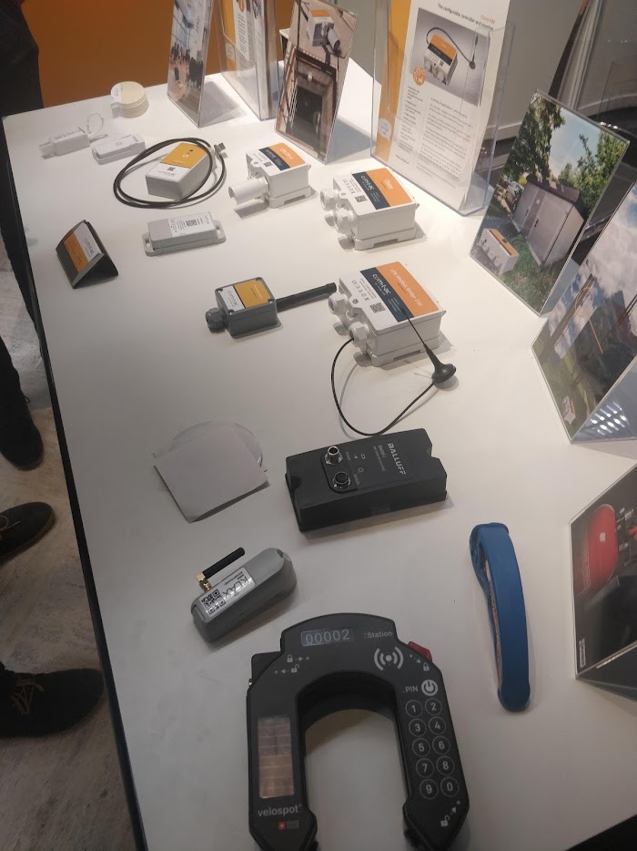 A stand displaying LoRaWAN sensors of many different types
