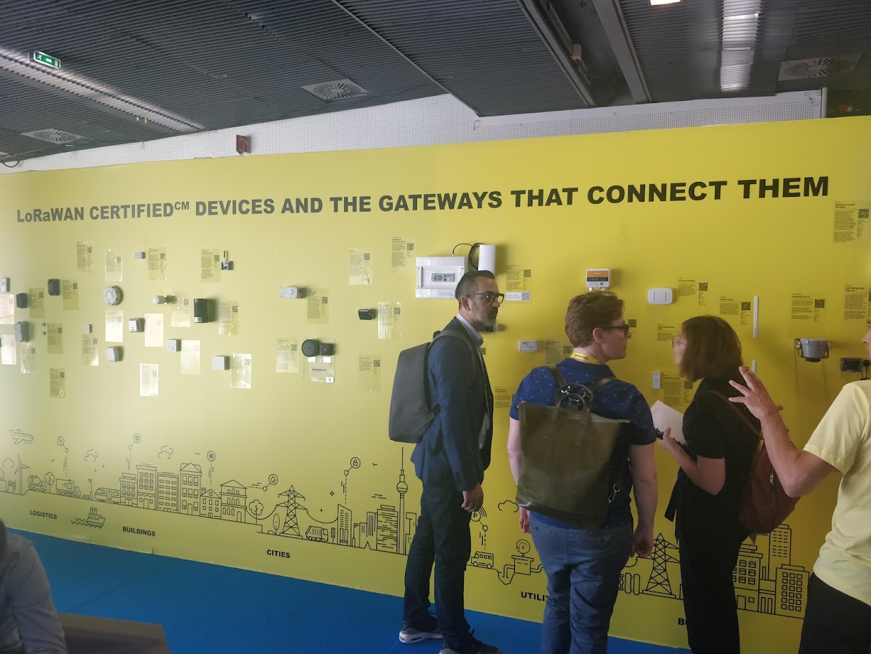 A trade show wall of LoRaWAN certified devices, headed "LoRaWAN certified devices and the gateways that connect them"