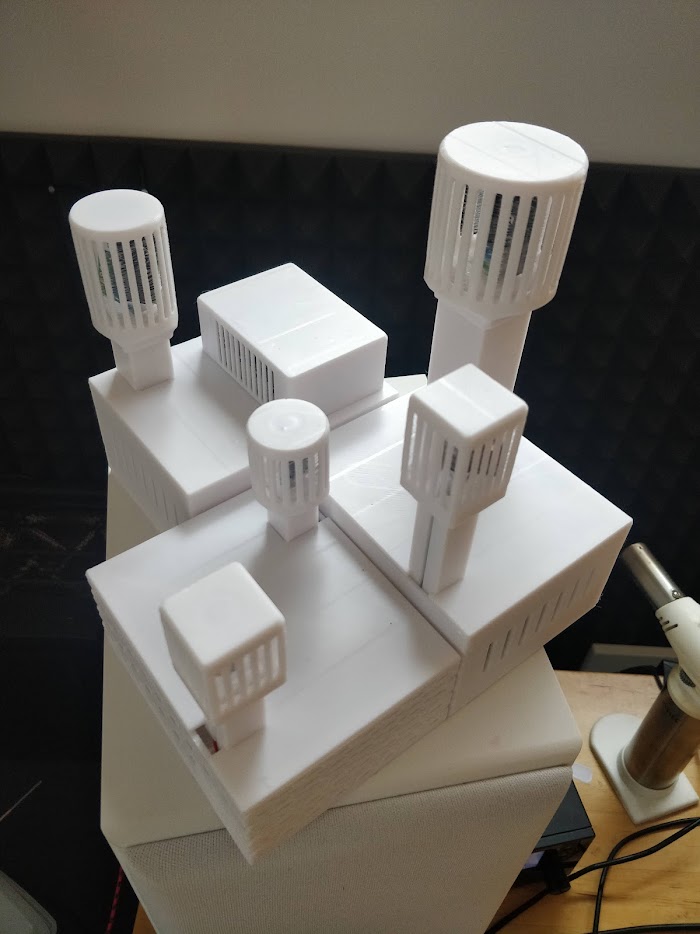 3D printed sensor housings with ventilated caps, printed in several sizes